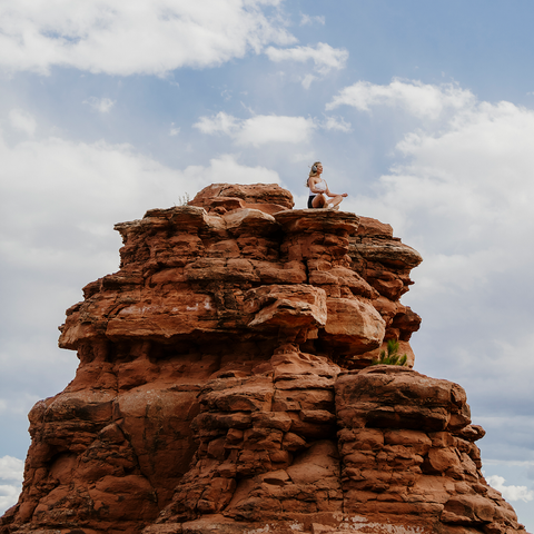 Person practicing mindfulness meditation to reduce stress naturally